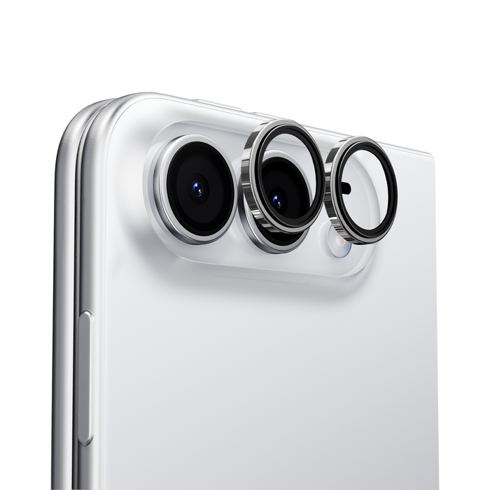 Close-up of a phone's camera area with individual black-rimmed lens protector rings seated over each lens