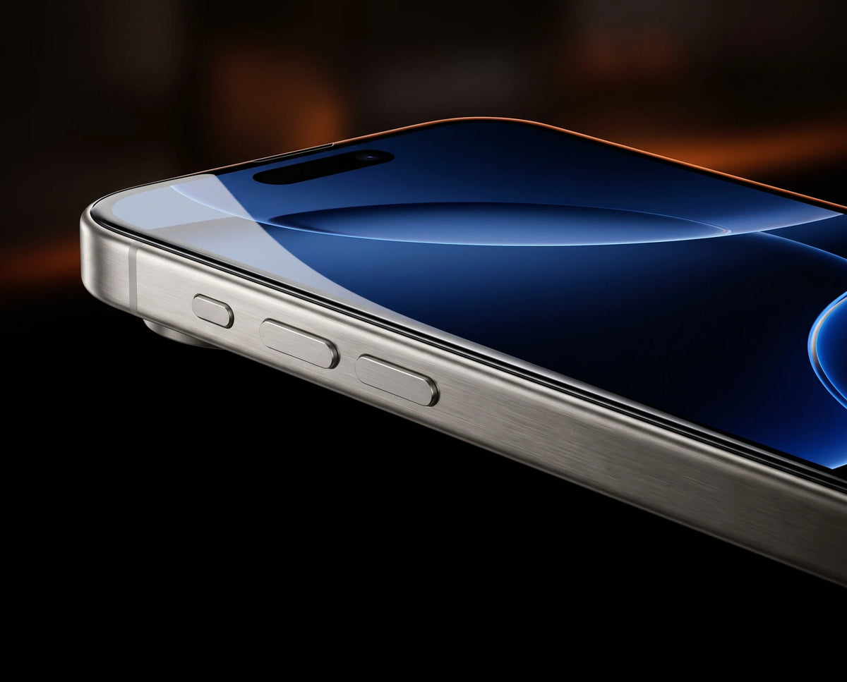 iPhone 16 Pro edge with TORRAS tempered glass sitting flush to the titanium frame — 2.5D edge-to-edge, no gap