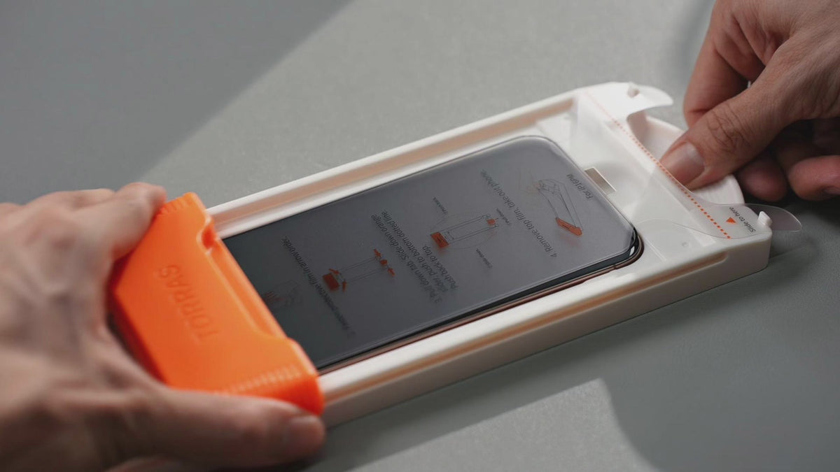TORRAS OrigArmor installation kit: frame-guided applicator with the protector ready to slide on