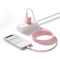 Pink braided TORRAS NeoCable 60W USB-C cable charging an iPhone from a wall adapter