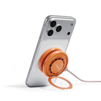 Energy Orange PolarCircle charger snapped onto the back of a phone, ring stand open and USB-C cable connected