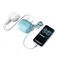 Blue TORRAS PackGo Cube 10K power bank charging an iPhone and an earbuds case at the same time