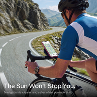 Cyclist on a mountain road following navigation on a handlebar-mounted phone, captioned the sun won't stop you