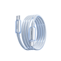 A white braided TORRAS IceFlow USB-C to USB-C charging cable coiled on a reflective surface