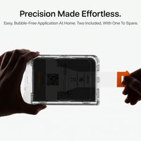 Pulling the tab on the HD Shield installation frame for easy, bubble-free application at home, 2 protectors included