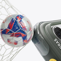 A football hitting the net beside the olive Q3 Air Football case's camera corner