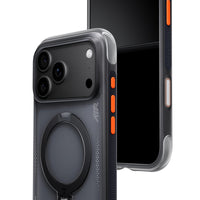 Smoke-grey translucent Ostand Q3 Air case at an angle in front of an iPhone 18 Pro, ring stand folded flat