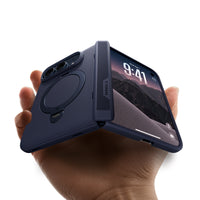 Hand holding a half-open foldable phone in a Deep Blue Ostand Q3 Spin case, showing the hinge cover and the lock screen