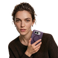 Woman holding a folded phone in a Purple Ostand Q3 Spin case near her face