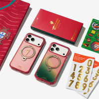 Flat lay of the TORRAS x FPF cases with a Portugal jersey, red gift box and gold number decal sheets