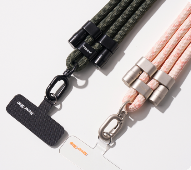 Two TORRAS LoopGo phone straps, olive and blush, with their clips and connector cards