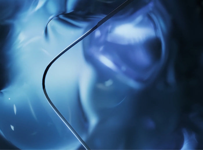 Close-up of a tempered glass screen protector edge over a deep blue gradient