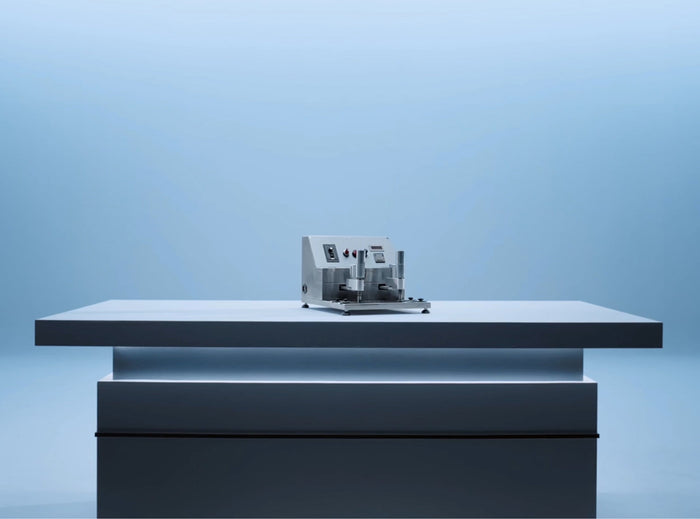 TORRAS Lab vertical pull test rig on a pale blue studio platform